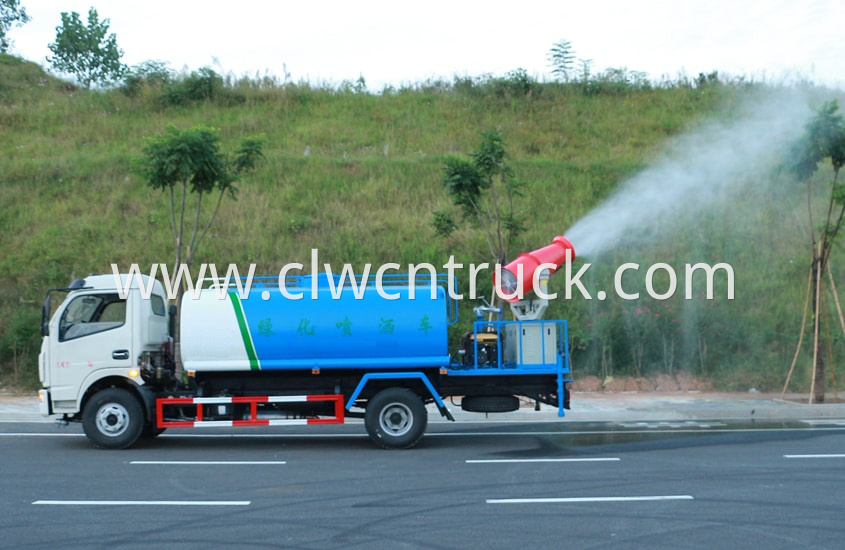 pesticide spraying truck in action